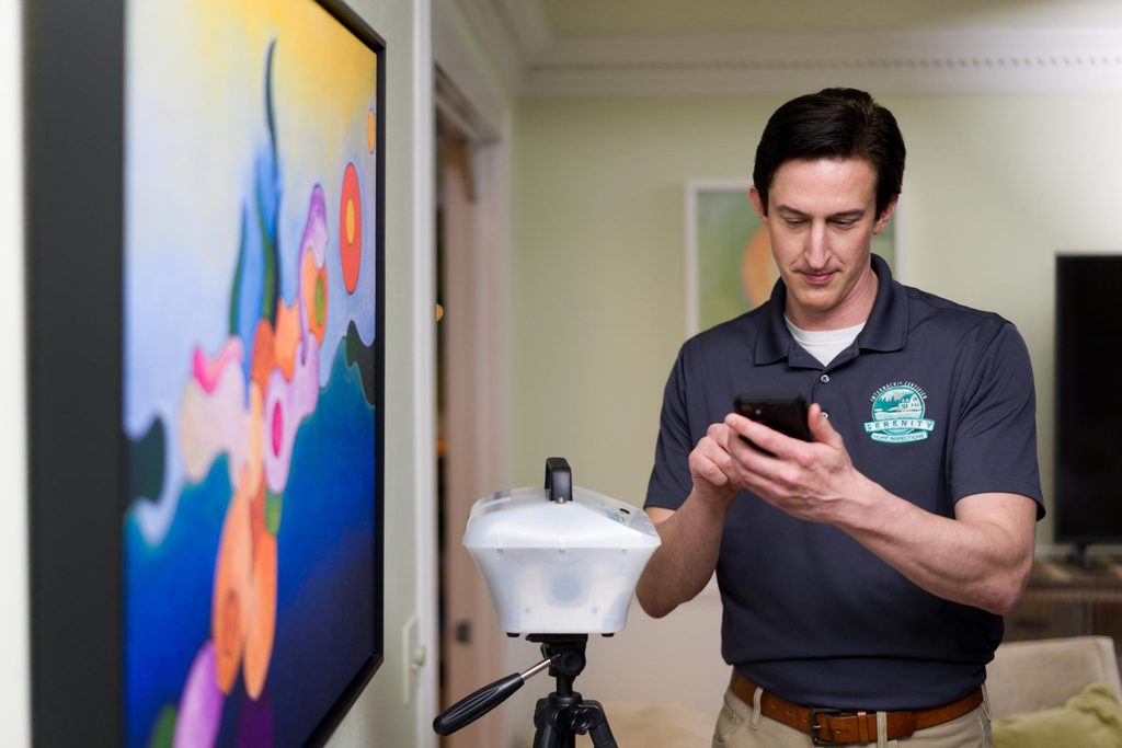 Serenity Home Inspections inspector setting up a continuous radon monitor inside a metro Atlanta home